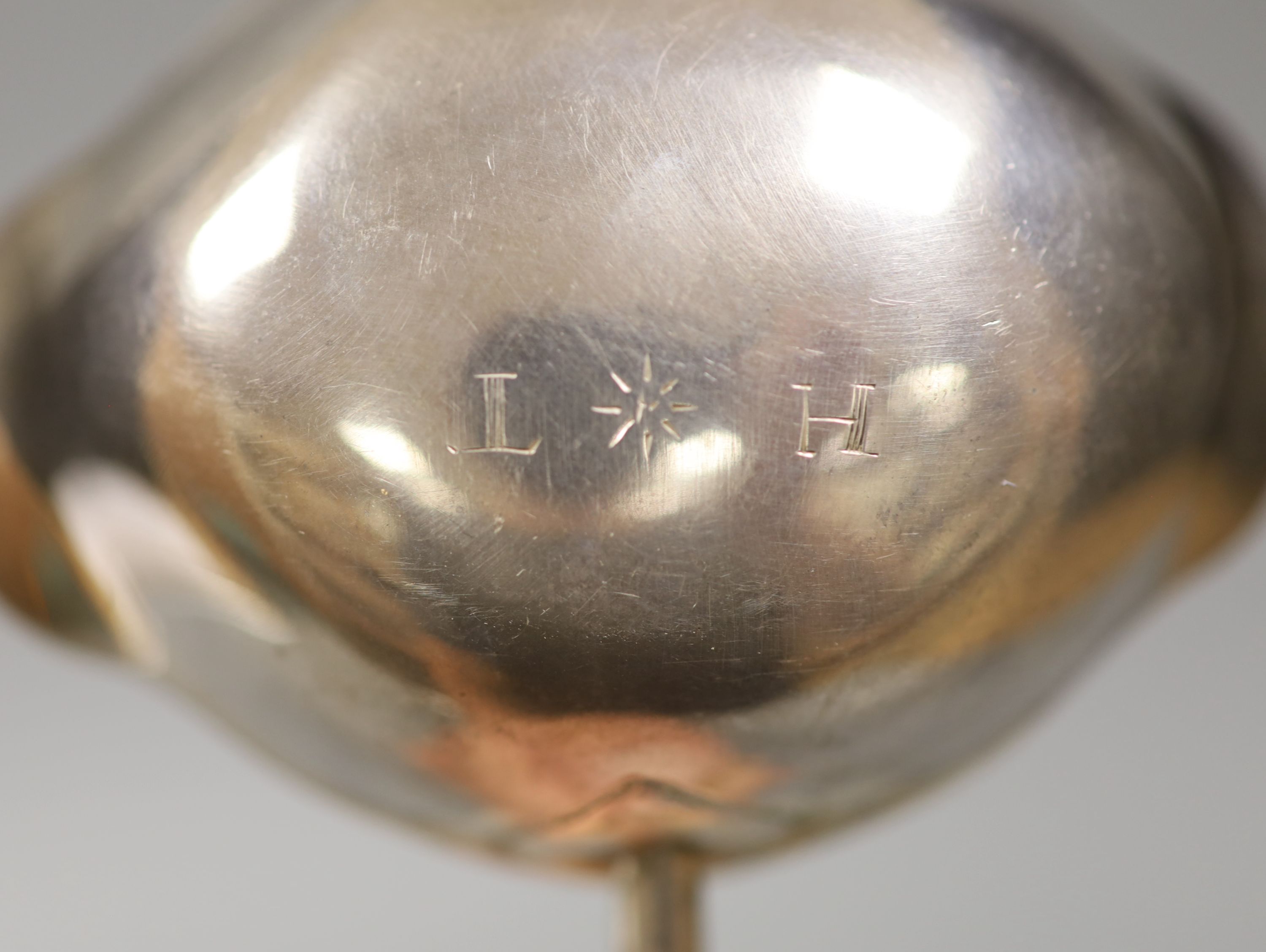 A George II silver toddy ladle with later? turned handle, maker, I.W, London, 1752, 39.4cm.